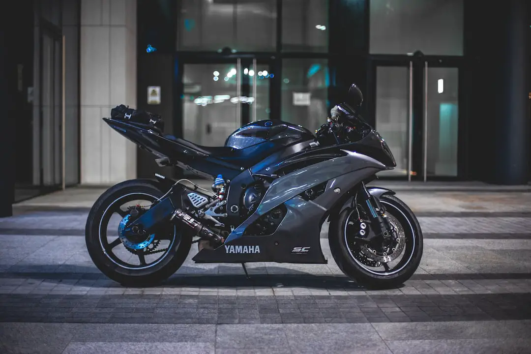 black Yamaha sports bike in front of building