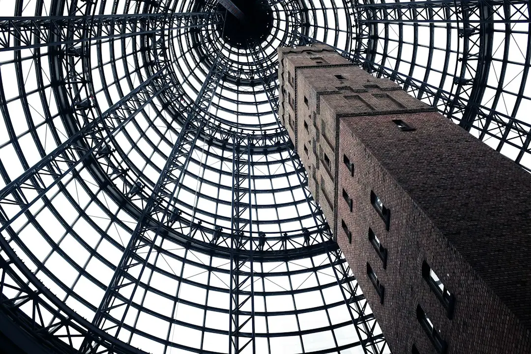 low-angel photography of gray concrete tower with windows