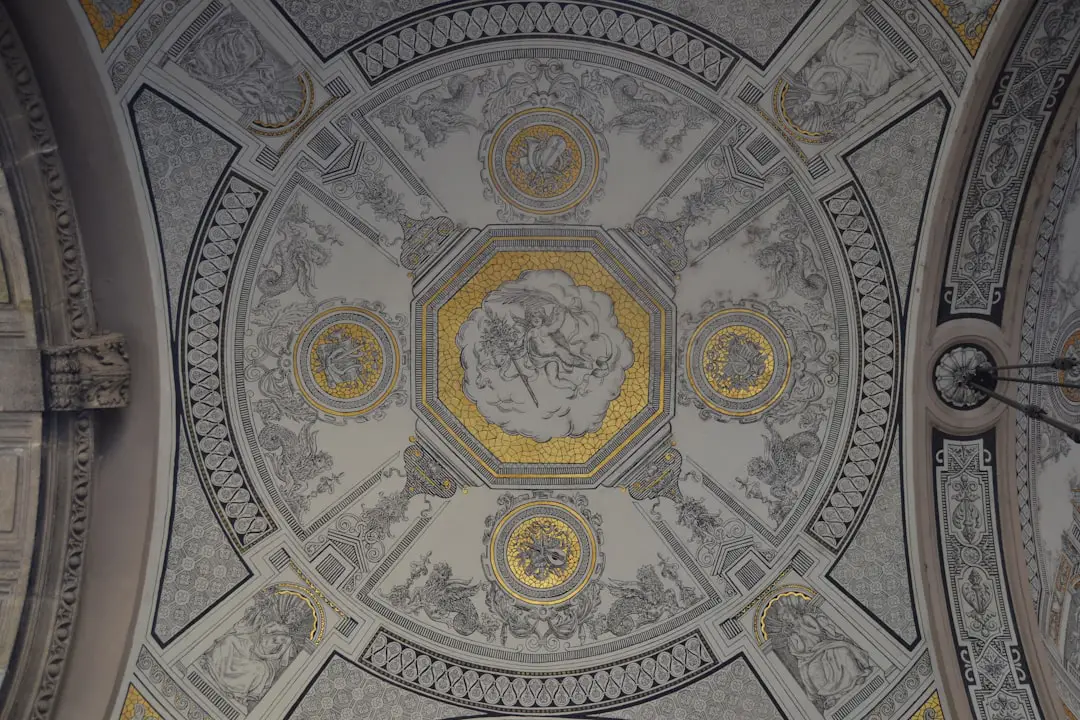 photo of white, gray, and yellow building ceiling