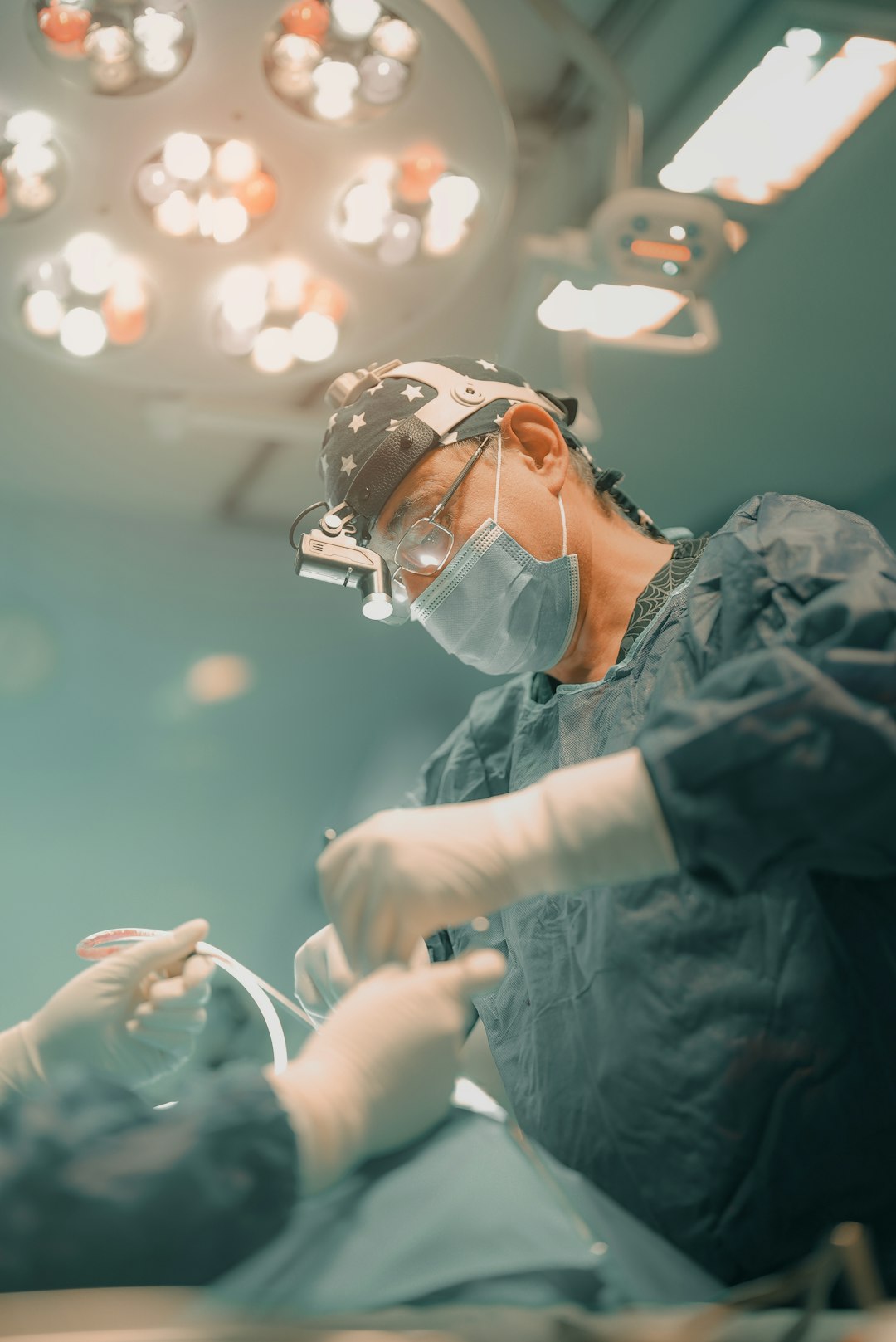 A surgeon is performing surgery on a patient