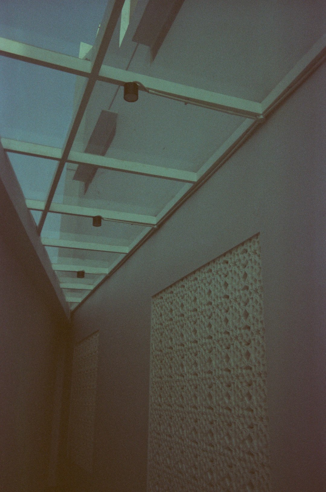a long hallway with a skylight above it