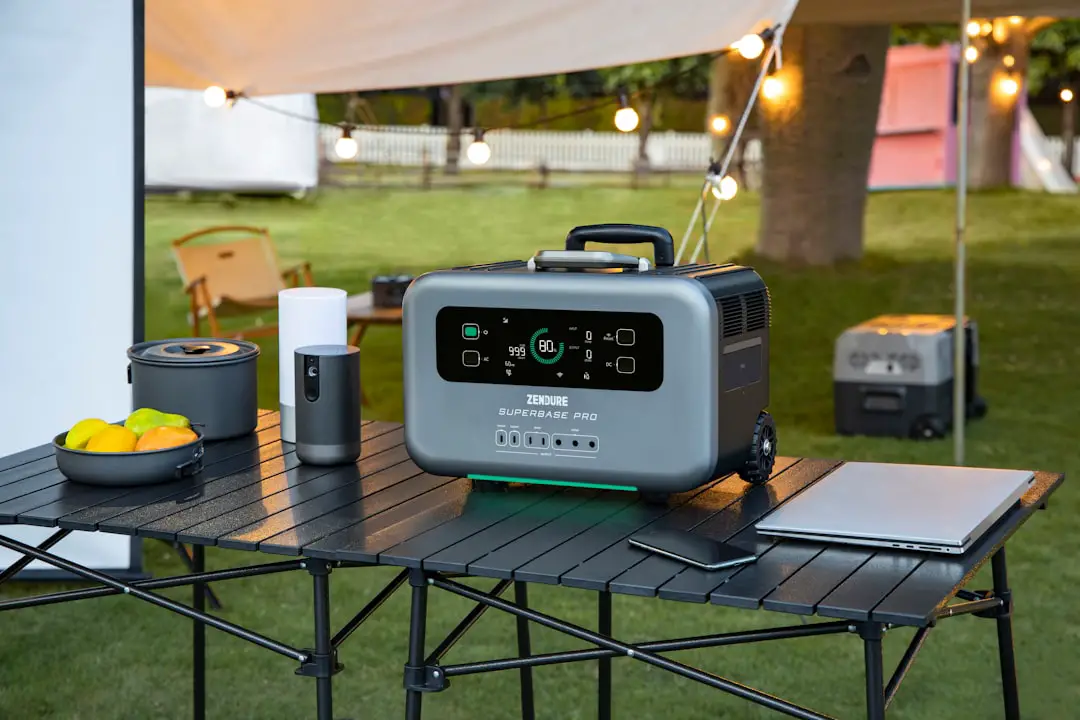 a table with a cooler and a laptop on it